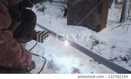 Professional worker performs welding work Professional worker performs welding work 122592184