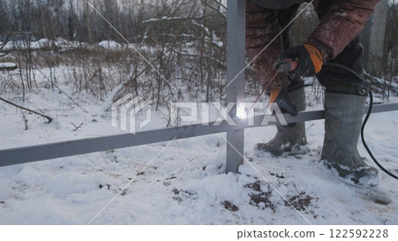 Welding work when installing a metal fence 122592228