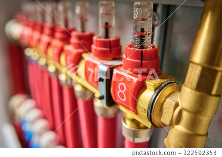 Close-up of underfloor heating manifold with flow meters and valves 122592353