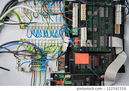 Wiring and circuit board inside electrical control panel 122592358