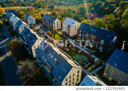 Residential buildings in suburban neighborhood with green spaces Residential buildings in suburban neighborhood with green spaces 122592405