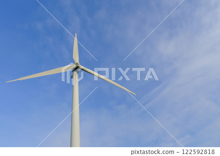 A wind turbine that shines in the blue sky A wind turbine that shines in the blue sky 122592818