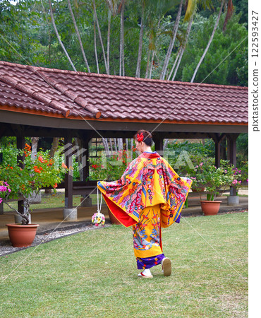 A woman wearing Okinawan traditional clothing A woman wearing Okinawan traditional clothing 122593427
