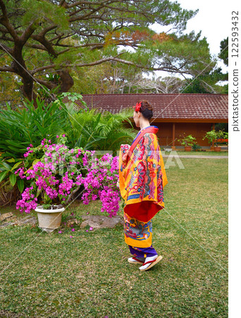 A woman wearing Okinawan traditional clothing A woman wearing Okinawan traditional clothing 122593432