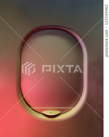 Closeup view of an airplane window with closed blinds. Traveling concept Closeup view of an airplane window with closed blinds. Traveling concept 122593462