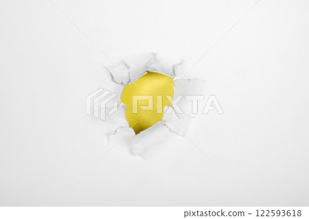 Top view of the hole from ripped white paper with a colored background. Mockup. Copy space. Presentation or template. Flat lay 122593618