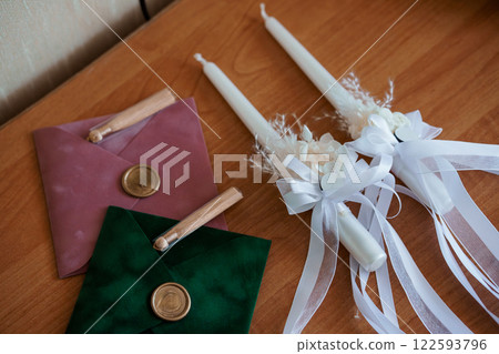 Elegant Wedding Decor with Candles and Envelopes 122593796