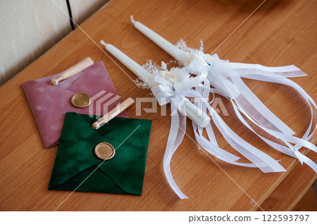 Elegant Wedding Invitations and Decor Items on Wooden Table Elegant Wedding Invitations and Decor Items on Wooden Table 122593797