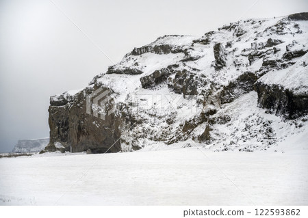 Landscape view of snow covered mountains in Iceland. Nature, travel, winter background, or wallpaper 122593862