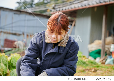 Woman working in the fields, country life, home garden 122593979