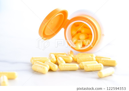 Image of taking capsule supplements to improve your physical condition Image of taking capsule supplements to improve your physical condition 122594353