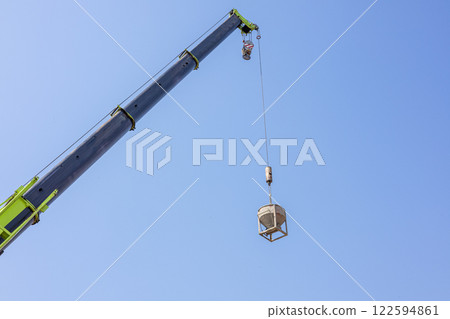Tower Cranes on Residential buildings Construction, Construction site, Construction of Multi Storey Residential Building, Tower Crane on formworks, Construction of Skyscrapers, Blue sky background. Tower Cranes on Residential buildings Construction, Construction site, Construction of Multi Storey Residential Building, Tower Crane on formworks, Construction of Skyscrapers, Blue sky background. 122594861
