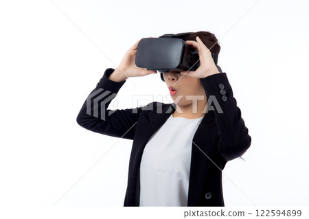 Portrait young asian businesswoman wearing headset virtual reality for device with experience. Portrait young asian businesswoman wearing headset virtual reality for device with experience. 122594899