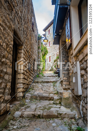 Narrow street in Ulcinj Old Town in Montenegro, the southernmost city at Montenegrin coast, Europe Narrow street in Ulcinj Old Town in Montenegro, the southernmost city at Montenegrin coast, Europe 122595104
