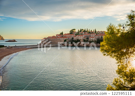 Sveti Stefan island near Budva at sunset light in winter time. Closed resort in Montenegro Sveti Stefan island near Budva at sunset light in winter time. Closed resort in Montenegro 122595111