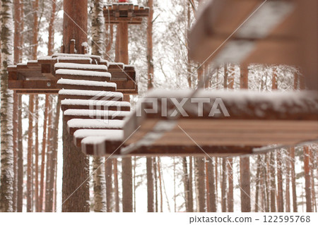 Snowy Rope Suspension Bridge 122595768