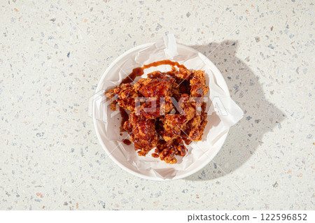 Crispy fried chicken thighs with red sauce 122596852