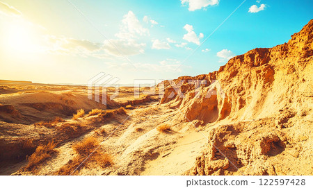 Arid land under blue skies and sunshine Arid land under blue skies and sunshine 122597428