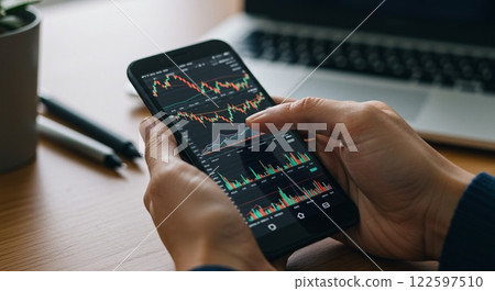 Person looking at stock chart Person looking at stock chart 122597510