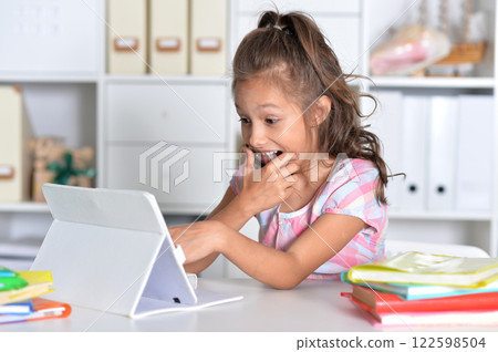 Portrait of girl studing with tablet at classroom 122598504