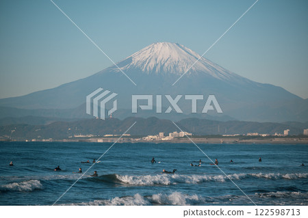 People enjoying surfing with Mount Fuji in the background People enjoying surfing with Mount Fuji in the background 122598713