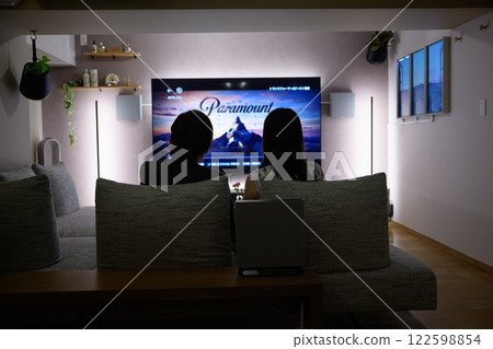 Watching movies in the living room Watching movies in the living room 122598854