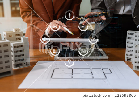 Asian business people using tablet for working technology and business, Renewable energy-based green businesses and global warming. Reduce CO2 emission. Asian business people using tablet for working technology and business, Renewable energy-based green businesses and global warming. Reduce CO2 emission. 122598869