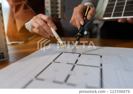 House model with agent asking costumer for contract to buy, get insurance or loan real estate or property. House model with agent asking costumer for contract to buy, get insurance or loan real estate or property. 122598878