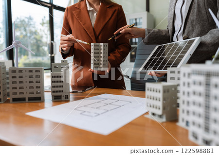 House model with agent asking costumer for contract to buy, get insurance or loan real estate or property. House model with agent asking costumer for contract to buy, get insurance or loan real estate or property. 122598881