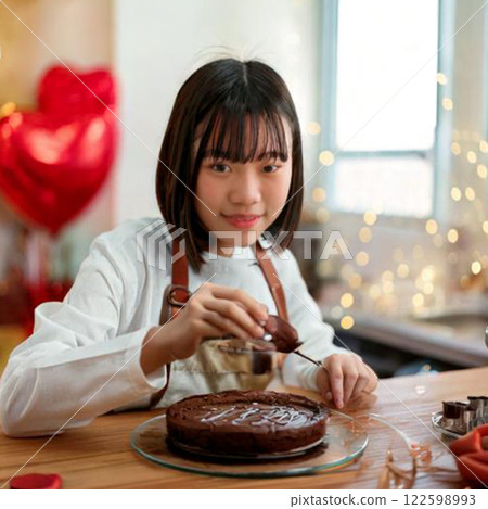 Girl making homemade chocolate sweets 3 122598993