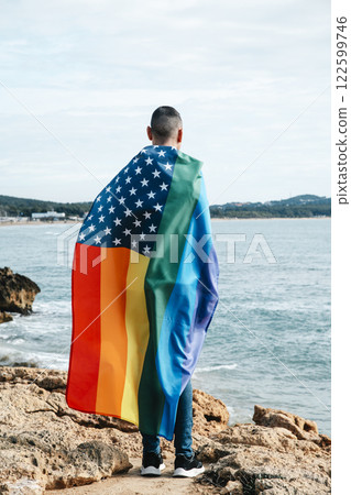 person wrapped in a rainbow american flag 122599746