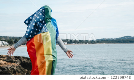 man covered with a rainbow US flag 122599748