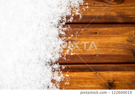 Top view of wooden terrace boards covered with snow, close-up Top view of wooden terrace boards covered with snow, close-up 122600019