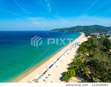 Amazing Top view sand beach landscape background,Summer sea waves crashing on sandy shore seascape background,Many travel people relax on beach at Phuket Thailand 122600061