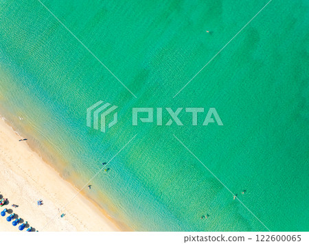 Amazing Top view sand beach landscape background,Summer sea waves crashing on sandy shore seascape background,Many travel people relax on beach at Phuket Thailand Amazing Top view sand beach landscape background,Summer sea waves crashing on sandy shore seascape background,Many travel people relax on beach at Phuket Thailand 122600065
