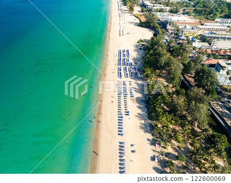 Amazing Top view sand beach landscape background,Summer sea waves crashing on sandy shore seascape background,Many travel people relax on beach at Phuket Thailand 122600069