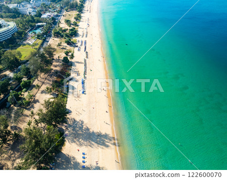Amazing Top view sand beach landscape background,Summer sea waves crashing on sandy shore seascape background,Many travel people relax on beach at Phuket Thailand Amazing Top view sand beach landscape background,Summer sea waves crashing on sandy shore seascape background,Many travel people relax on beach at Phuket Thailand 122600070