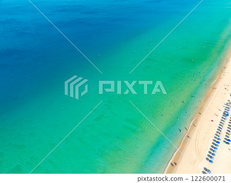 Amazing sea surface in summer season background,Nature waves sea beach background,High angle view waves seascape nature view,Wide angle drone shot,Top view beach sand Amazing sea surface in summer season background,Nature waves sea beach background,High angle view waves seascape nature view,Wide angle drone shot,Top view beach sand 122600071