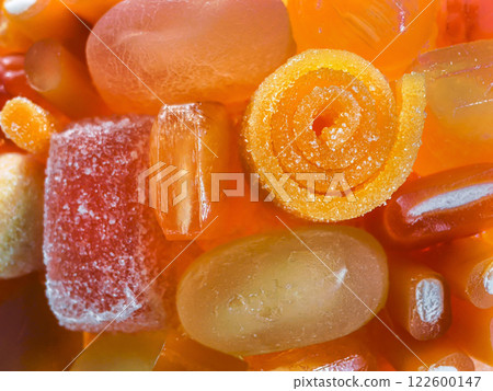 Colorful assortment of various gummy candies in vibrant shapes and sizes captured in close-up during bright daylight Colorful assortment of various gummy candies in vibrant shapes and sizes captured in close-up during bright daylight 122600147