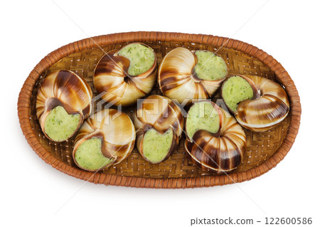 escargot snail filled with garlic and parsley butter in wicker basket isolated on white background. Top view. Flat lay 122600586