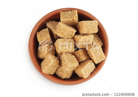 brown sugar in a ceramic bowl isolated on white background. Top view. Flat lay brown sugar in a ceramic bowl isolated on white background. Top view. Flat lay 122600606