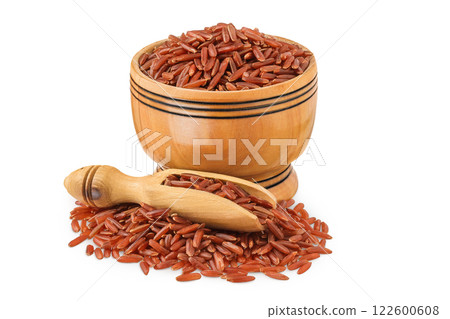 red rice in a wooden bowl isolated on white background 122600608