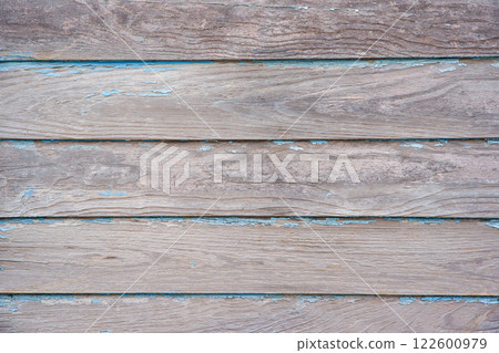 Blue paint peeling off the wooden wall 122600979