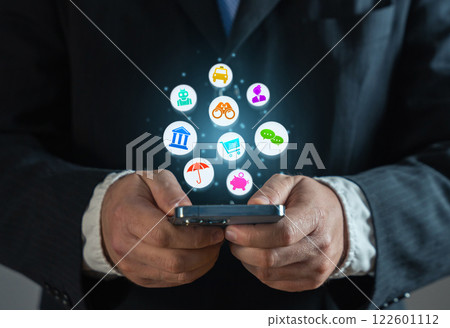 Businessman with a phone and a cloud of various services and mobile applications. Online business promotion and new experience for new customers users. An application that saves time and money. 122601112