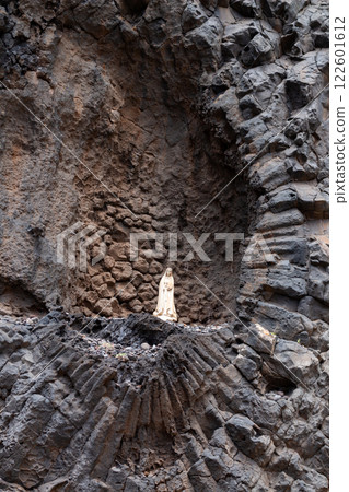 Detail of a rock with Madonna statue, Madeira 122601612
