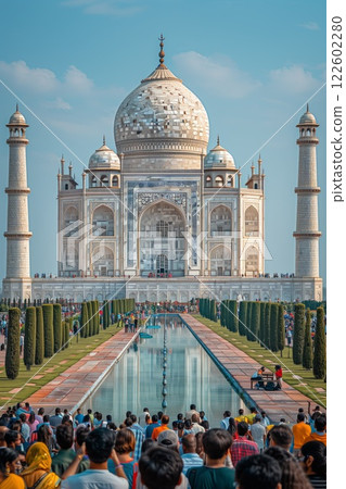 a stunning white marble mausoleum with intricate details, reflecting in the serene pool and framed by manicured gardens under a bright sky 122602280