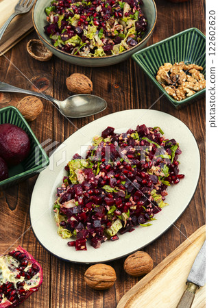 Healthy salad - boiled beetroot with pomegranate. 122602620