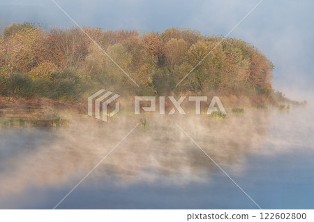 Daugava river coasteline in cold autumn morning, fog over the water 122602800