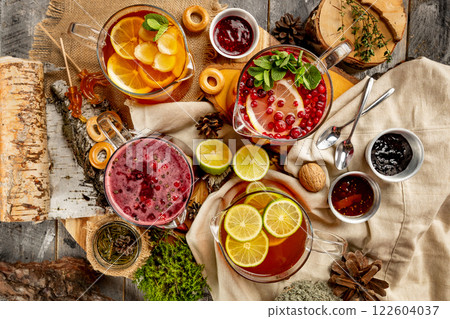 Top view image of various tea pots group at decorated with bakery and jam rural table background. Top view image of various tea pots group at decorated with bakery and jam rural table background. 122604037