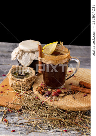 Closeup cup of turkish coffee with lemon and jam jar at wooden table background. Closeup cup of turkish coffee with lemon and jam jar at wooden table background. 122604235
